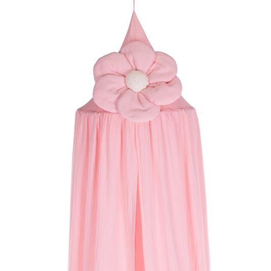 Κρεμαστή κουρτίνα οροφής canopy σε ροζ χρώμα με διακοσμητικό λουλούδι στην κορυφή, τοποθετημένο σε παιδική γωνιά με ροζ διακοσμητικά