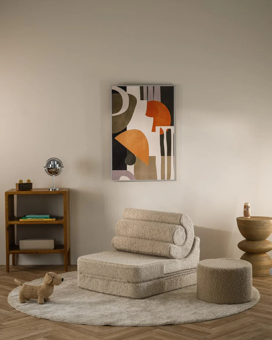Wigiwama Flipster chair in beige teddy fabric with matching pouffe in a modern, child-friendly living room